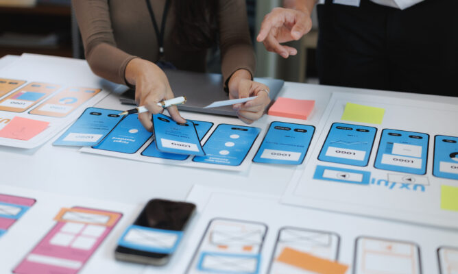 Ux designers working on user interface and user experience of mobile application